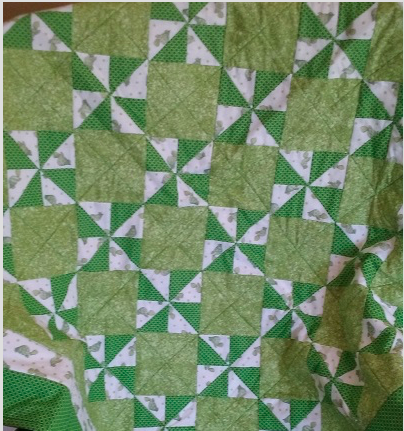 Green and White Pinwheel Quilt